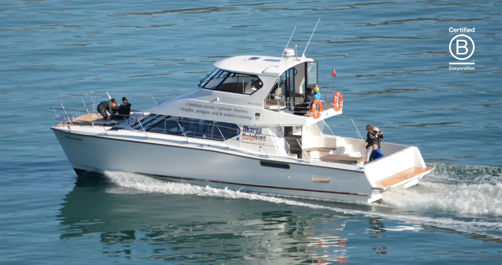 The Akaroa Dolphins vessel departing on a harbour cruise