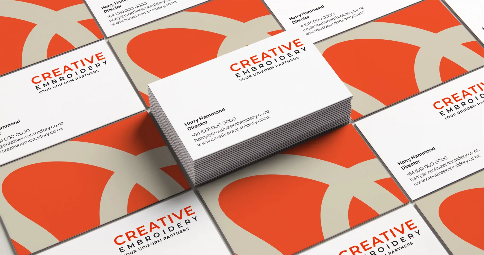 Creative Embroidery brand identity shown on business card mockups