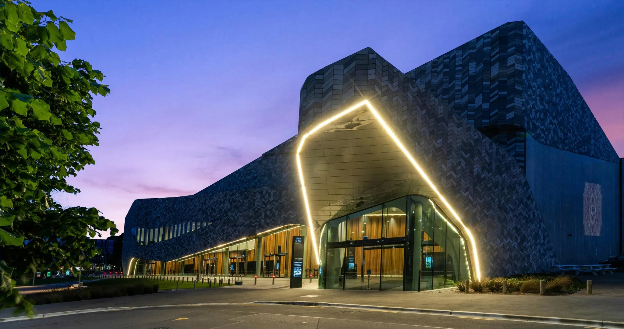 Te Pae Christchurch Convention Centre lit up at dusk